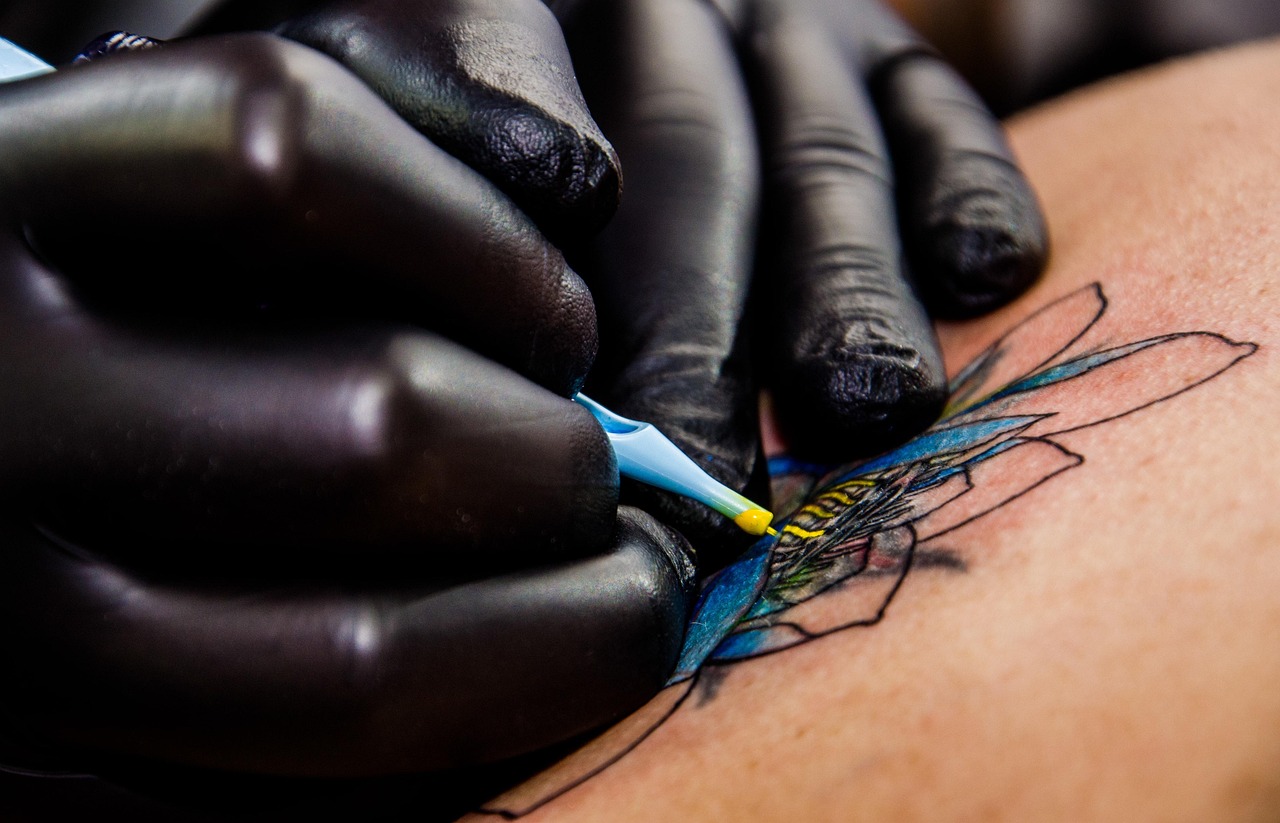 tattoo artist drawing custom design